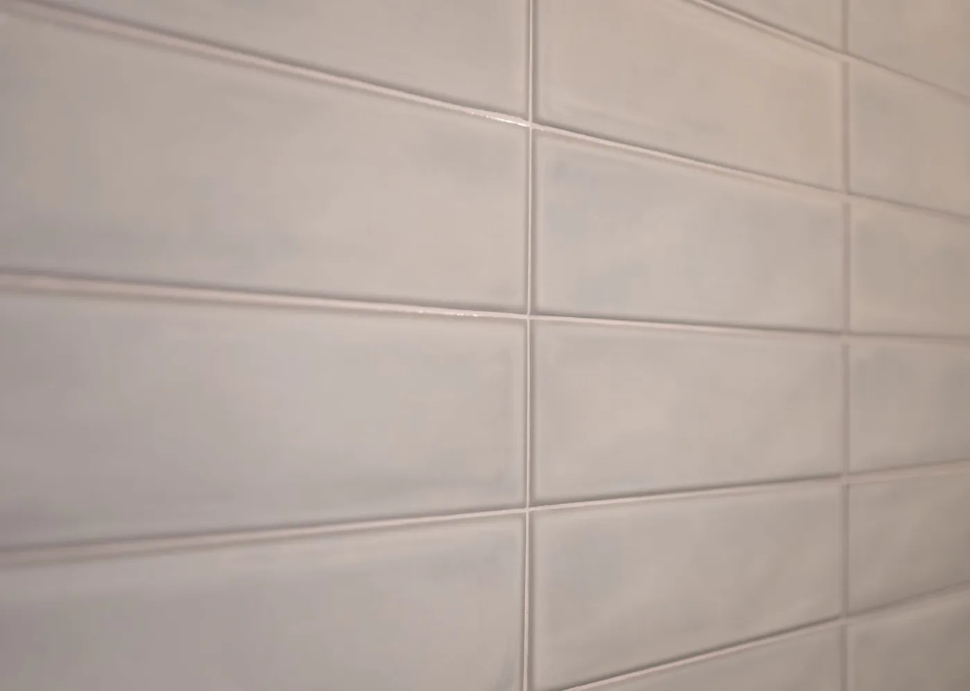 Gray stacked tile detail on a shower wall