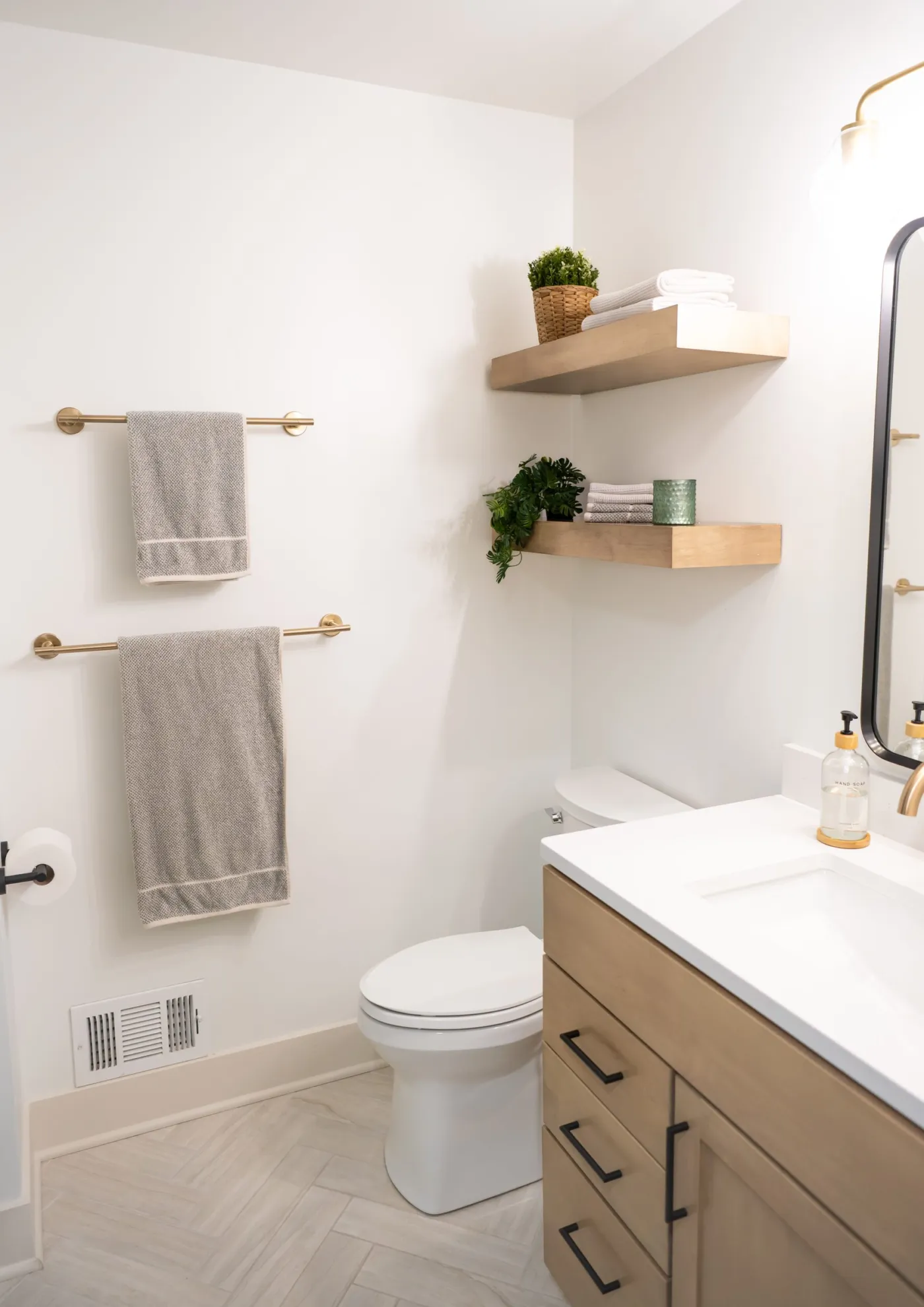 Guest bathroom remodel in Salem Township with a wood vanity and glass shower