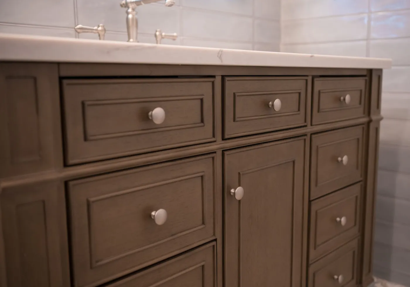 wood-vanity-with-quartz-counter-and-brushed-nickel-faucet